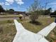 Brick street in front of grassy yard with school across the road at 2701 W Cherry St, Tampa, FL 33607