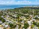 Aerial view showcases the home's location within a lush, green neighborhood near the bay at 2709 Upton S St, Gulfport, FL 33711