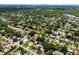 Aerial view of the home in a neighborhood with mature trees near the water at 2709 Upton S St, Gulfport, FL 33711