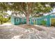 Beautiful home featuring a spacious backyard with mature trees and paved area at 2709 Upton S St, Gulfport, FL 33711