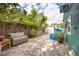 Spacious backyard patio features comfortable seating, a storage shed and a large potted plant at 2709 Upton S St, Gulfport, FL 33711