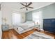 Bright bedroom with hardwood floors, a ceiling fan, and ample natural light for a cozy and inviting space at 2709 Upton S St, Gulfport, FL 33711