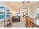 Bright dining room boasts wainscoting, wood-look floors, and a wine bar at 2709 Upton S St, Gulfport, FL 33711