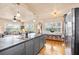 Bright living room open to kitchen features hardwood floors and an abundance of natural light at 2709 Upton S St, Gulfport, FL 33711
