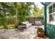 Backyard patio with comfortable seating surrounded by lush greenery for relaxing outdoor living at 2709 Upton S St, Gulfport, FL 33711