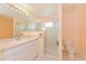Clean bathroom featuring a glass-enclosed shower, vanity, and neutral tile flooring at 2718 Chipley Ave, North Port, FL 34286