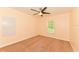 A cozy bedroom features carpet floors and a ceiling fan for added comfort at 2718 Chipley Ave, North Port, FL 34286