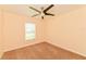 A bright bedroom offers natural light with a neutral color palette, and ceiling fan at 2718 Chipley Ave, North Port, FL 34286