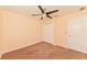 A simple bedroom with a ceiling fan and closet provides a calm and tidy space at 2718 Chipley Ave, North Port, FL 34286