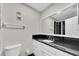 Modern bathroom with granite countertops, sleek fixtures, and a glass-enclosed shower at 2943 Bough Ave # C, Clearwater, FL 33760