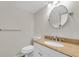 Bathroom featuring a white vanity with granite countertop and decorative fixtures at 2943 Bough Ave # C, Clearwater, FL 33760