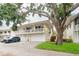 Charming two-story townhome with a private balcony and a well-manicured lawn at 2943 Bough Ave # C, Clearwater, FL 33760