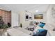 Stylish living room featuring a comfortable couch, fireplace, and entertainment center at 2943 Bough Ave # C, Clearwater, FL 33760