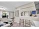 View of a spacious living room with a breakfast bar opening to the kitchen, creating an open floor plan at 2943 Bough Ave # C, Clearwater, FL 33760