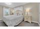 Airy main bedroom featuring white bedding and furniture, and lots of natural light at 2943 Bough Ave # C, Clearwater, FL 33760