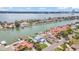 Aerial view of a waterfront neighborhood with homes, docks, and waterways at 319 Midway Is, Clearwater Beach, FL 33767