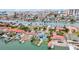 Waterfront homes with private docks and swimming pools line the serene canals in this charming coastal community at 319 Midway Is, Clearwater Beach, FL 33767