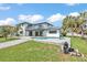 A spacious backyard features an in-ground pool, a patio, and a second story deck at 319 Midway Is, Clearwater Beach, FL 33767