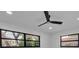 Bright bedroom featuring two windows with black trim and a ceiling fan at 319 Midway Is, Clearwater Beach, FL 33767