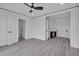 Bedroom featuring light hardwood floors, white trim, and multiple closets and entryways at 319 Midway Is, Clearwater Beach, FL 33767