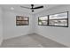 Bright bedroom with two windows and neutral color palette at 319 Midway Is, Clearwater Beach, FL 33767