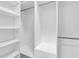 Bright walk-in closet features custom shelving and ample storage space at 319 Midway Is, Clearwater Beach, FL 33767