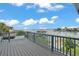 A spacious outdoor deck with views of the water at 319 Midway Is, Clearwater Beach, FL 33767