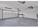 Spacious garage with large garage door, utility sink, and ample storage space for vehicles and equipment at 319 Midway Is, Clearwater Beach, FL 33767
