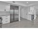 Bright kitchen with white cabinetry, stainless steel appliances, recessed lights, creating a modern, functional space at 319 Midway Is, Clearwater Beach, FL 33767
