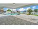 This outdoor patio boasts beautiful paver flooring, water views, a dock, and a private pool at 319 Midway Is, Clearwater Beach, FL 33767