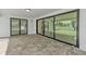Outdoor patio space featuring sleek tile flooring, modern sliding doors, and serene views at 319 Midway Is, Clearwater Beach, FL 33767