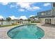 Backyard oasis featuring a private pool with a patio and waterfront views at 319 Midway Is, Clearwater Beach, FL 33767