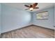 Bedroom featuring wood-look tile flooring, neutral paint, a window and baseboard trim at 3619 15Th Se Ave, Largo, FL 33771