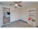 This bonus room has gray floors, a mirrored wall, shelving, and access to the garage at 3619 15Th Se Ave, Largo, FL 33771