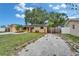 Home's front exterior shows well-maintained lawn, driveway and solar panels at 3619 15Th Se Ave, Largo, FL 33771