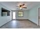Living room with wood-look flooring, modern paint, and lots of light at 3619 15Th Se Ave, Largo, FL 33771