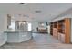 Open living space with kitchen, wood-look flooring, and modern lighting at 3619 15Th Se Ave, Largo, FL 33771