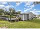 The backyard has an above ground pool with a deck, and a well-maintained lawn at 36725 Arcadia Ave, Myakka City, FL 34251