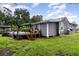The backyard has an above ground pool with a deck, and a well-maintained lawn at 36725 Arcadia Ave, Myakka City, FL 34251