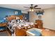 Comfortable bedroom features a ceiling fan, wooden furniture, and rustic decor at 36725 Arcadia Ave, Myakka City, FL 34251