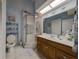 Well-lit bathroom featuring a glass-enclosed shower and vanity with a sink at 39650 Us Hwy 19 N, Tarpon Springs, FL 34689
