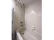 Clean bathroom with a tiled shower and bathtub, offering a serene bathing experience at 39650 Us Hwy 19 N, Tarpon Springs, FL 34689