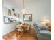 Cozy dining area features a chandelier and laminate flooring; open to kitchen at 39650 Us Hwy 19 N, Tarpon Springs, FL 34689