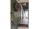Inviting entryway showcasing the tiled floor and beautiful purple decorative wreath at 39650 Us Hwy 19 N, Tarpon Springs, FL 34689