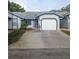 Charming single-story home featuring a one-car garage and well-maintained landscaping at 39650 Us Hwy 19 N, Tarpon Springs, FL 34689