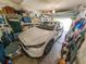 Organized garage featuring ample storage shelves and a clean, modern car at 39650 Us Hwy 19 N, Tarpon Springs, FL 34689