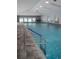 Resident indoor pool with plenty of natural light and seating at 39650 Us Hwy 19 N, Tarpon Springs, FL 34689