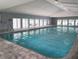 Resident indoor pool with plenty of natural light and seating at 39650 Us Hwy 19 N, Tarpon Springs, FL 34689