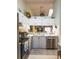 Bright kitchen with stainless steel appliances, a double sink, and upper cabinet storage at 39650 Us Hwy 19 N, Tarpon Springs, FL 34689