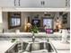 Open kitchen view into the living area, showcasing a modern sink and decor at 39650 Us Hwy 19 N, Tarpon Springs, FL 34689